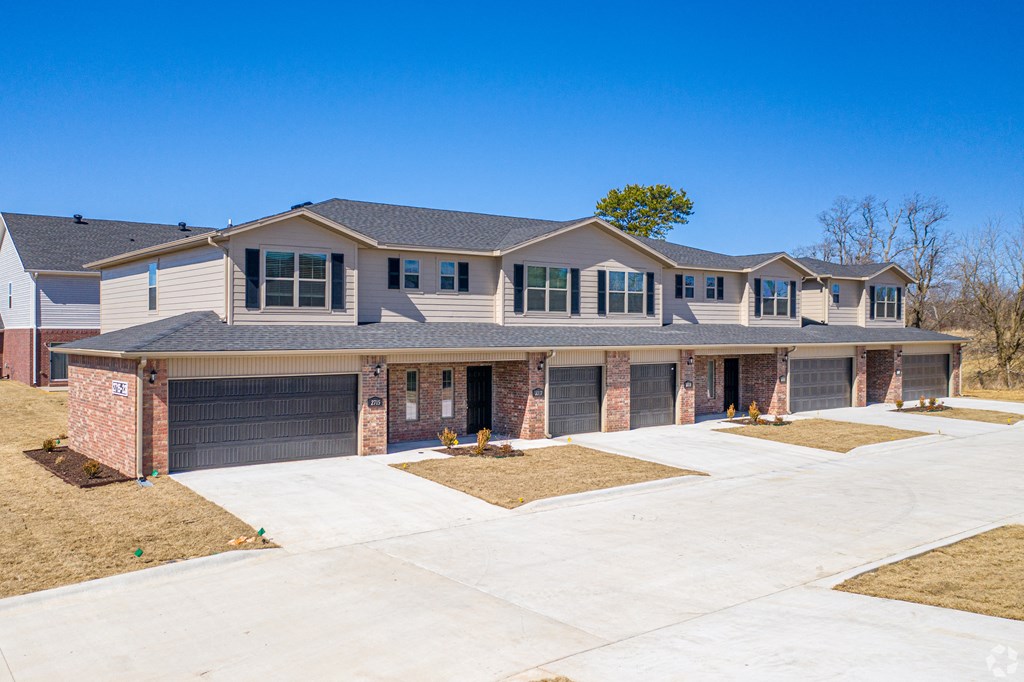 a large house with a driveway in front of it