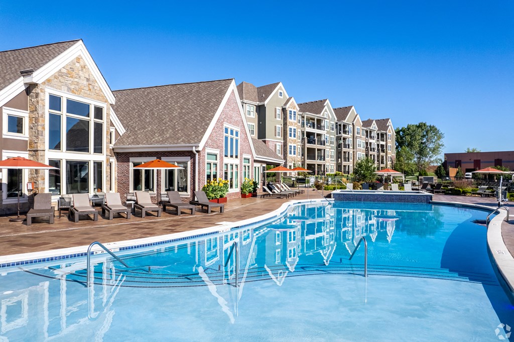 a large swimming pool with apartments in the background  at Waterside Residences on Quivira, Lenexa, 66215