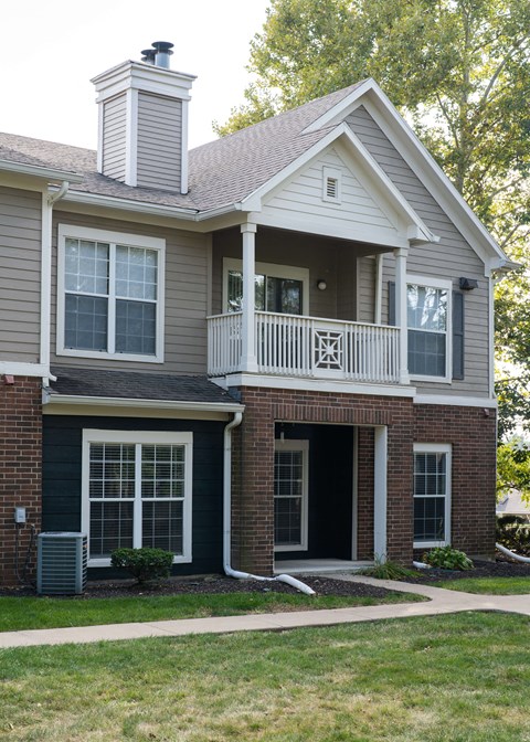 a house with a balcony on top of it at Centennial Park Apartments, Kansas, 66213