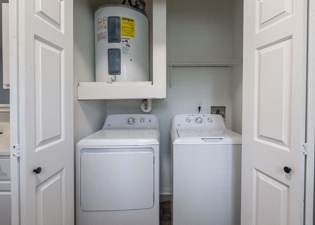 a washer and dryer in the laundry room of a manufactured home at Centennial Park Apartments, Overland Park, 66213