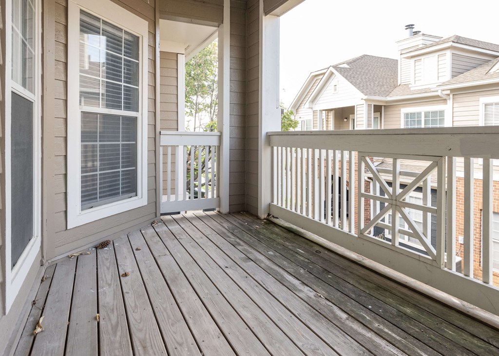 the deck has a view of the neighborhood and the house at Centennial Park Apartments, Overland Park