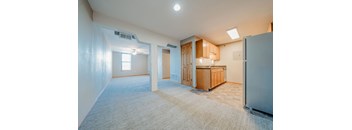 Kitchen and Living Room in 2 Bedroom Apartment at Abernathy Lofts Apartments