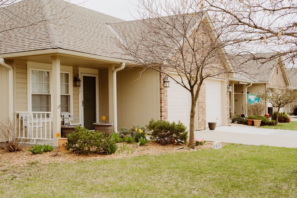 a house with a tree in the front yard