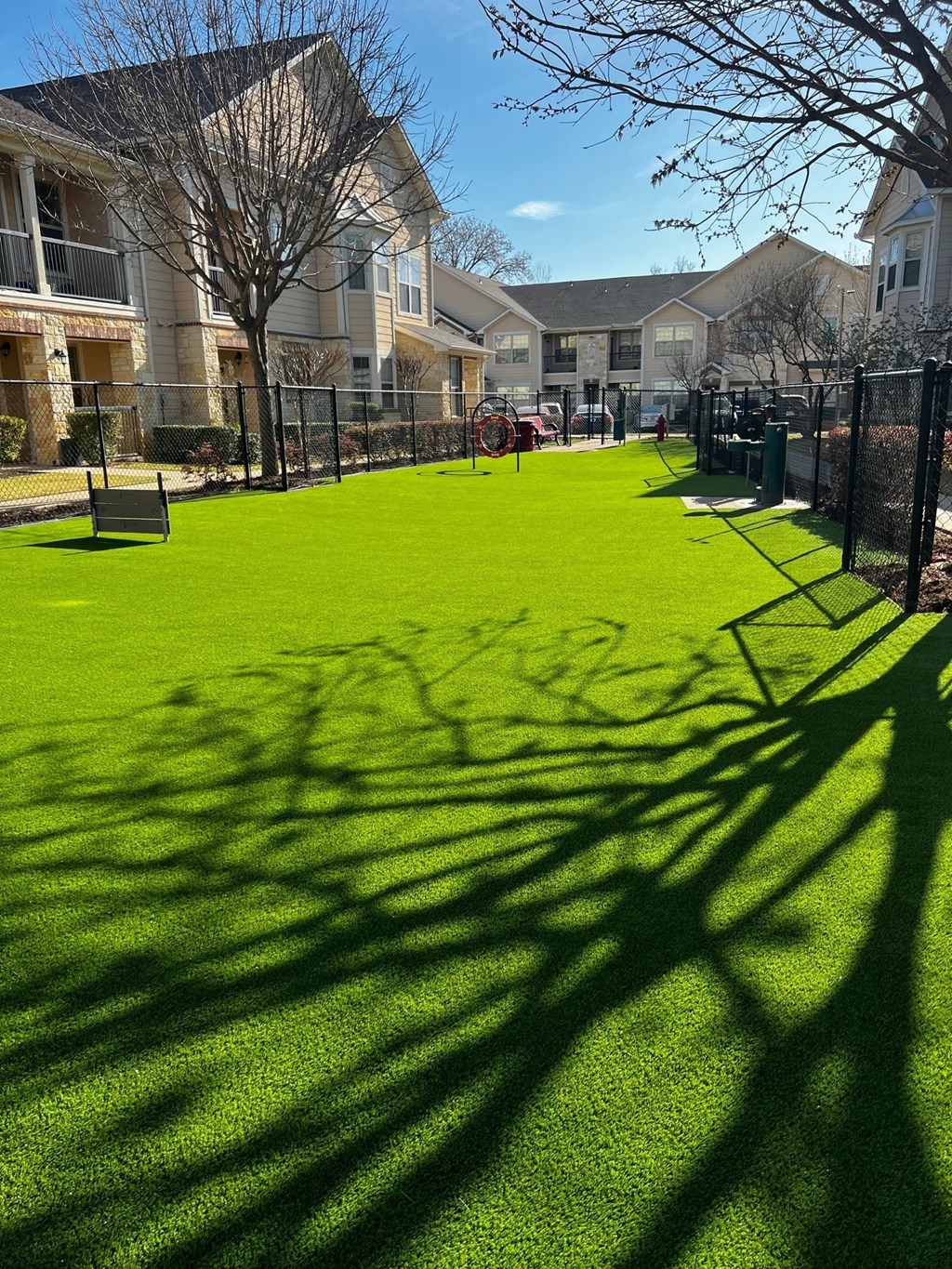 a green lawn in front of a building