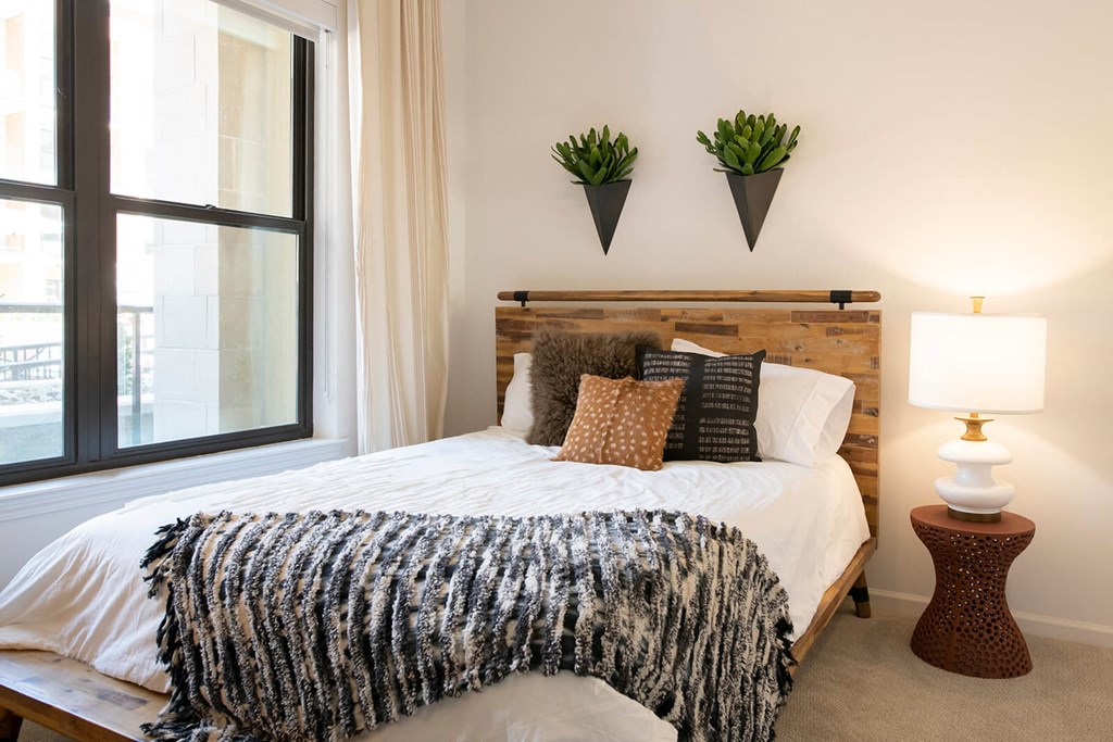 Bedroom with cozy bed at The Residences at Galleria, Overland Park, Kansas