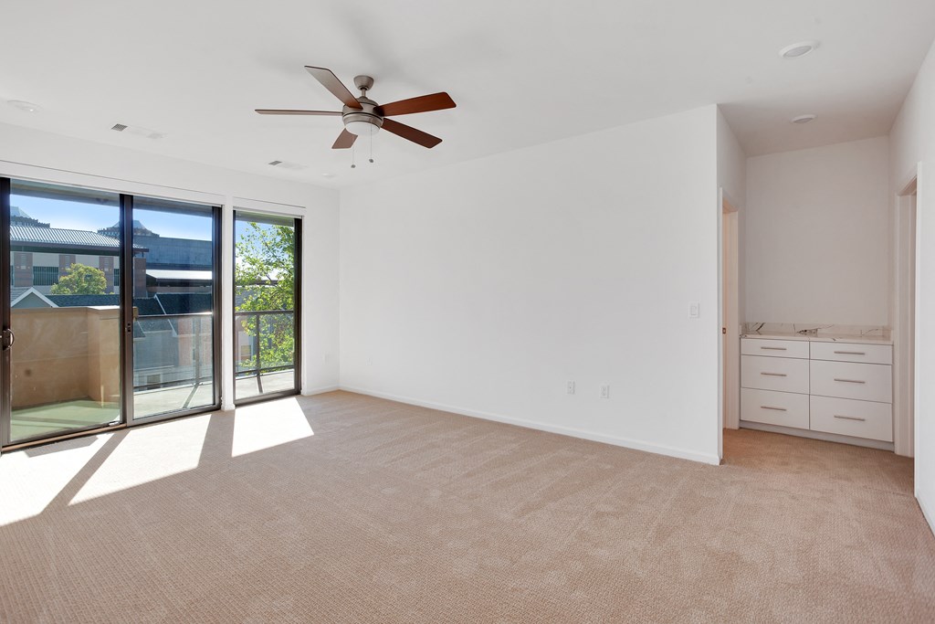 Empty bedroom with large windows at 44 Washington, Missouri