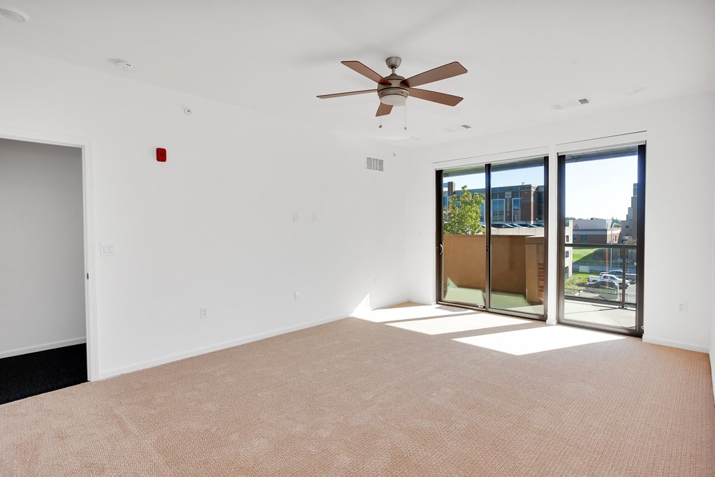 Empty bedroom with balcony at 44 Washington, Kansas City, MO 64111