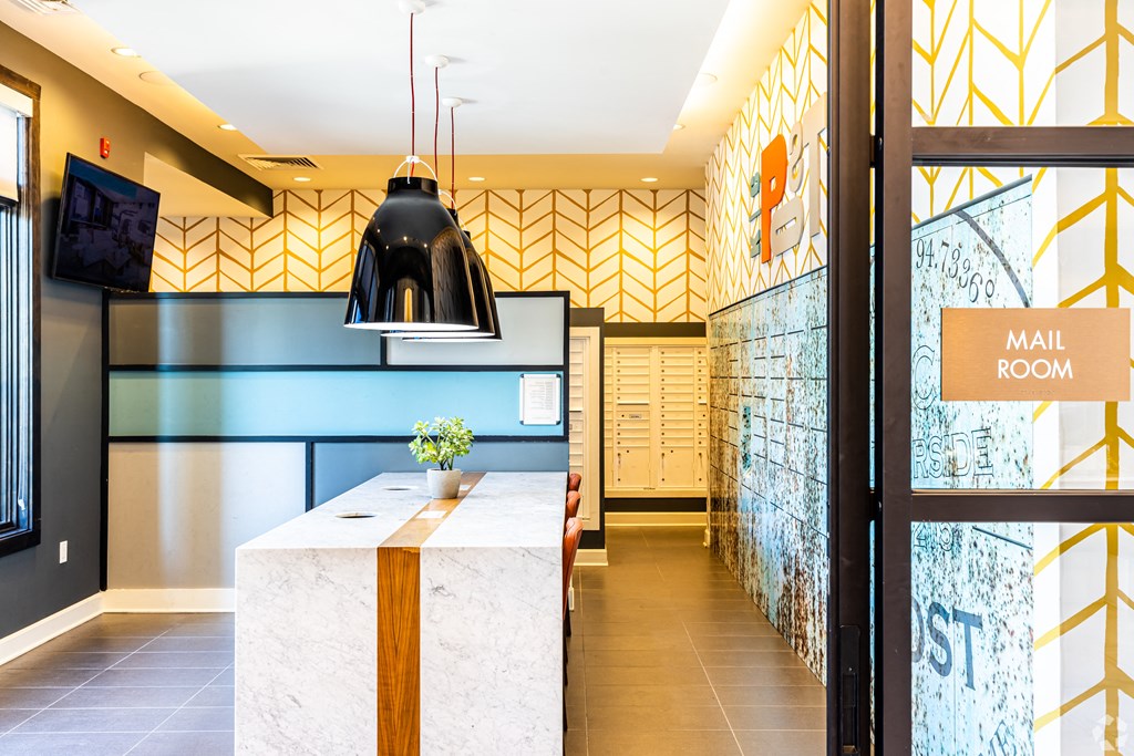 a lobby with a reception desk and a mail room  at Waterside Residences on Quivira, Lenexa, KS