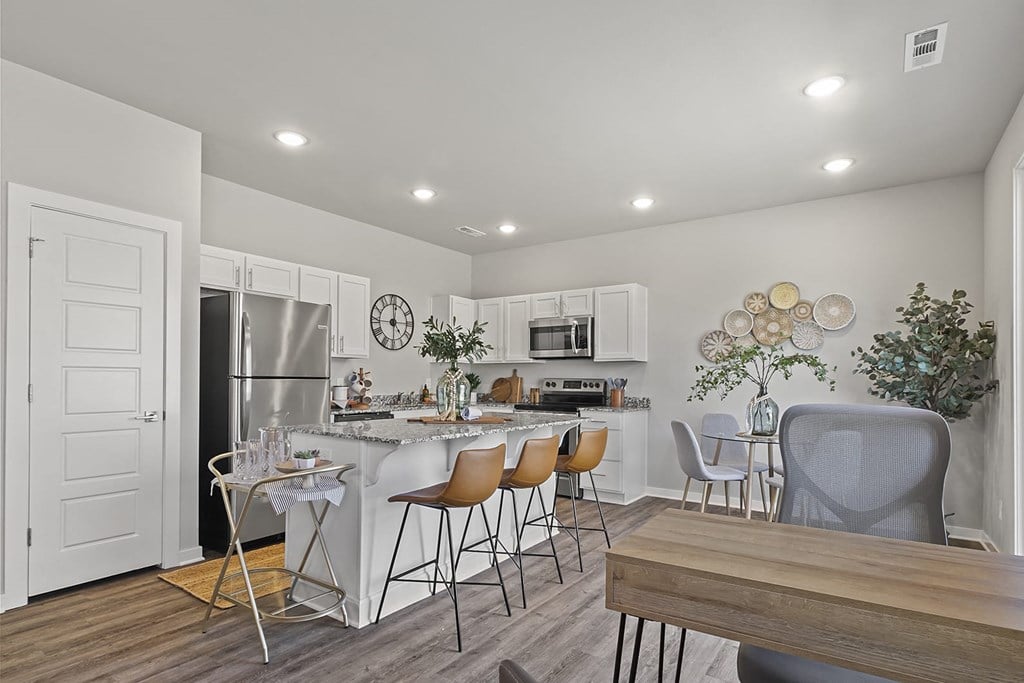 a kitchen and dining room with a table and chairs at Hillcrest Village, Arkansas, 72762