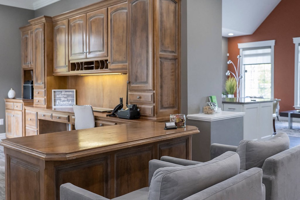 a home office with a desk and chairs