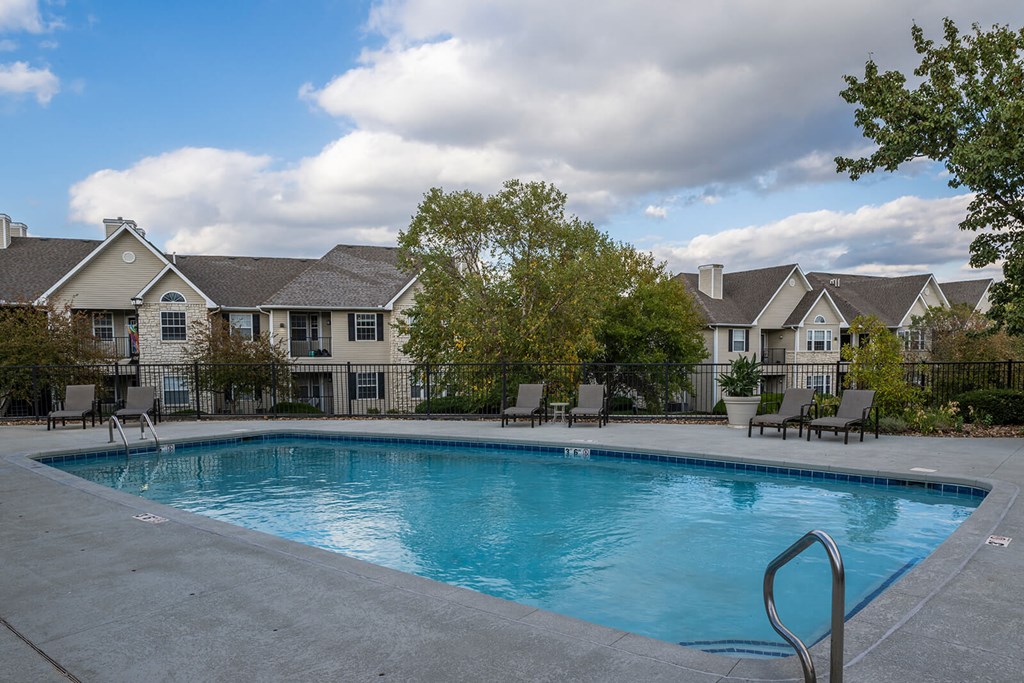 swimming pool with apartments in background