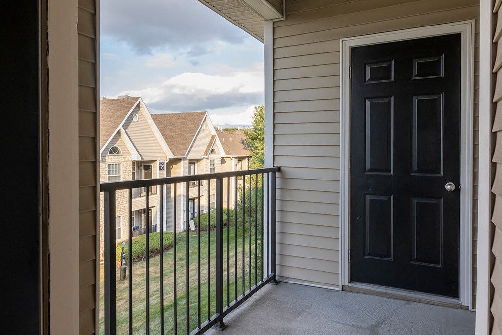 the view from the balcony with a black door