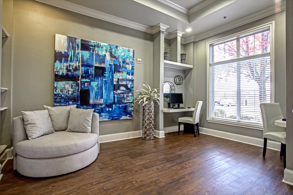business center with large windows, seating, and computer