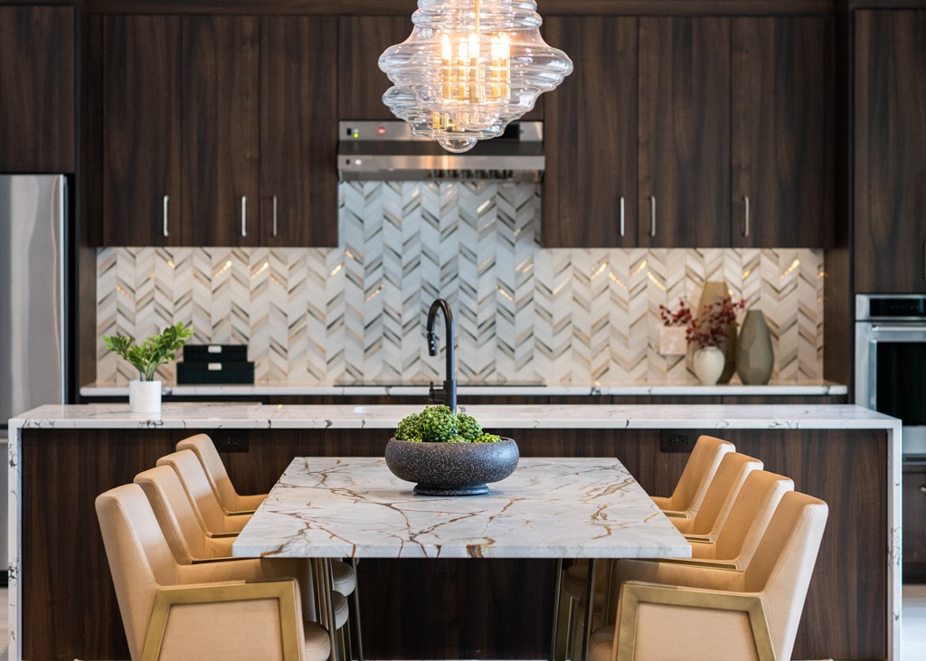 a kitchen with a marble table and chairs a kitchen with a marble table and chairs at The Clearing at ONE28, Olathe, KS, 66062