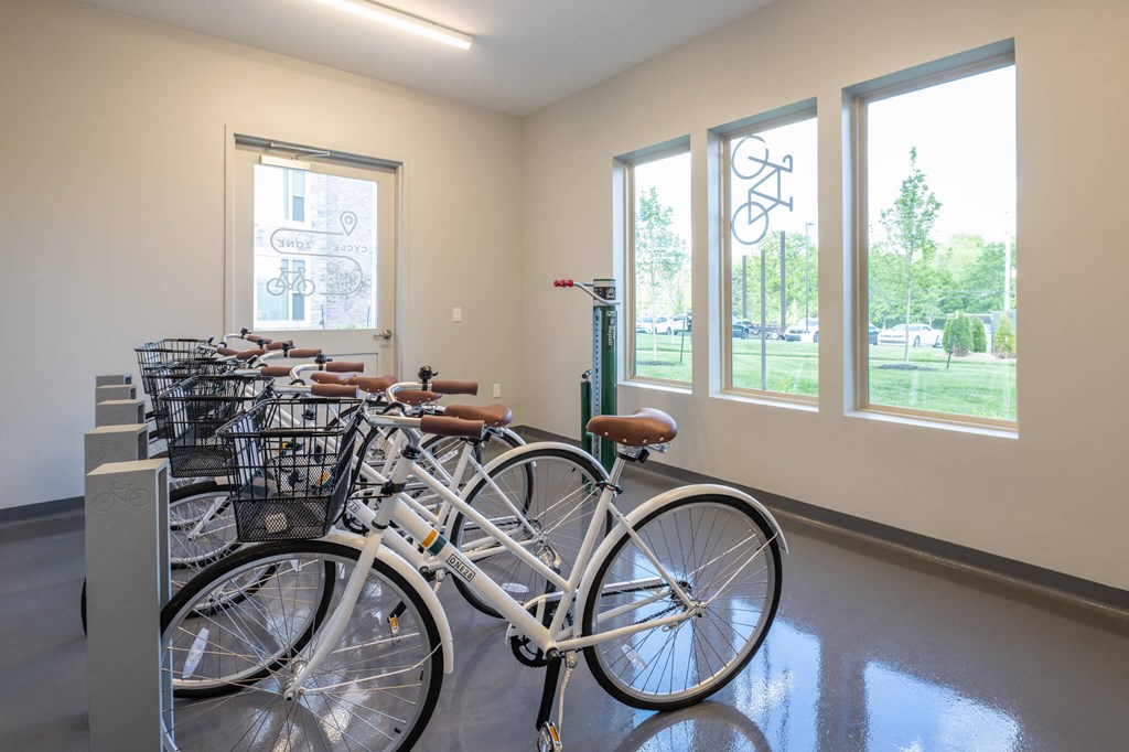 a row of bikes parked in a room