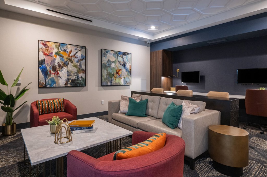 a living room with couches and chairs and a table