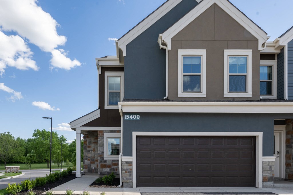 a home with a garage door in front of it
