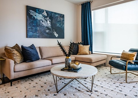 Living room with couch and frame in background at The Villas at Waterside, Lenexa, KS, 66214