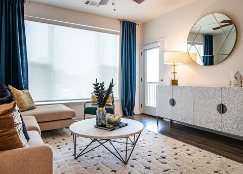 Living room with couch, table and cabinet at The Villas at Waterside, Kansas, 66214