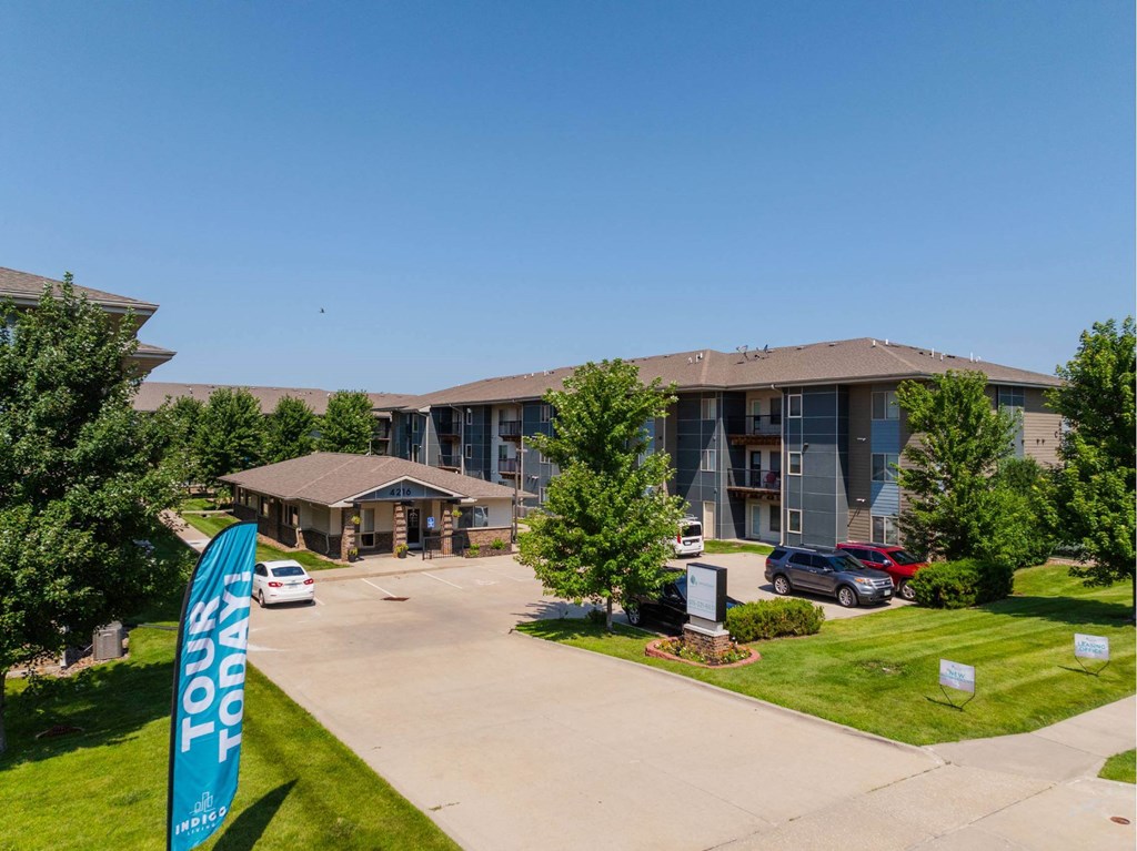 A banner that says "Tour Today" is in front of a building.