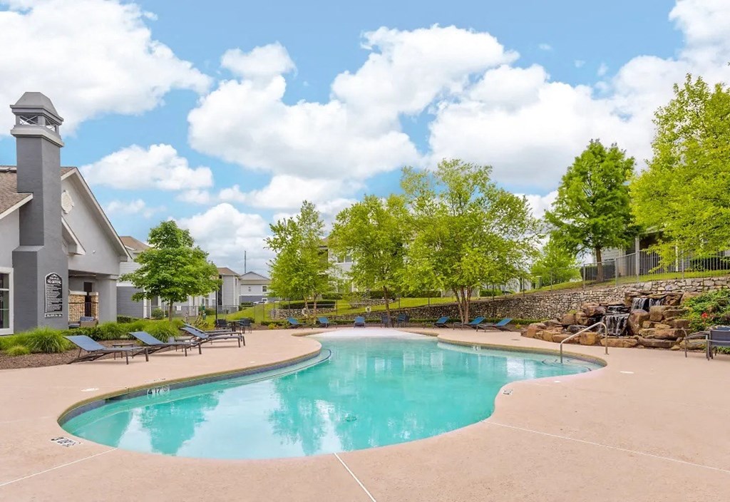 sparkling swimming pool with outdoor seating area