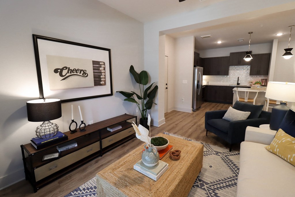 a living room with a couch and a coffee table at The Crest at South Point Apartments, Georgia, 30253