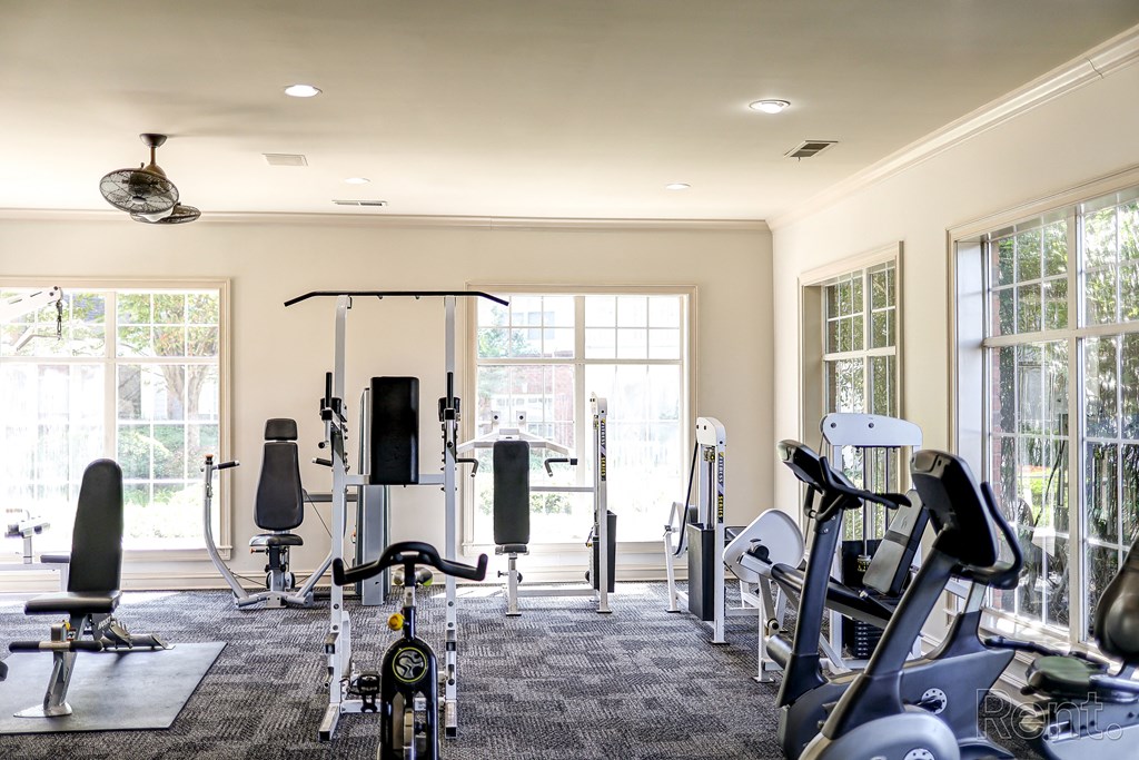 The Crest at Sugarloaf Apartment Community Fitness Center with Free Weights and Exercise Equipment