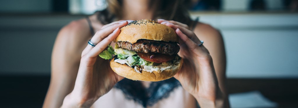 Woman Having A Burger at The Crest at Acworth, Georgia, 30102