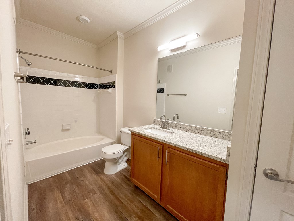 Bathroom with Wood Style Flooring and Soaking Tub located in Lawrenceville, GA