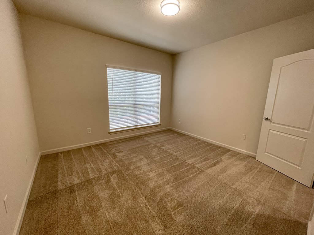 Bedroom with Oversized Window and Walk-In Closet located in Lawrenceville, GA