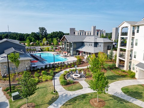 A residential area with a swimming pool and a small building.