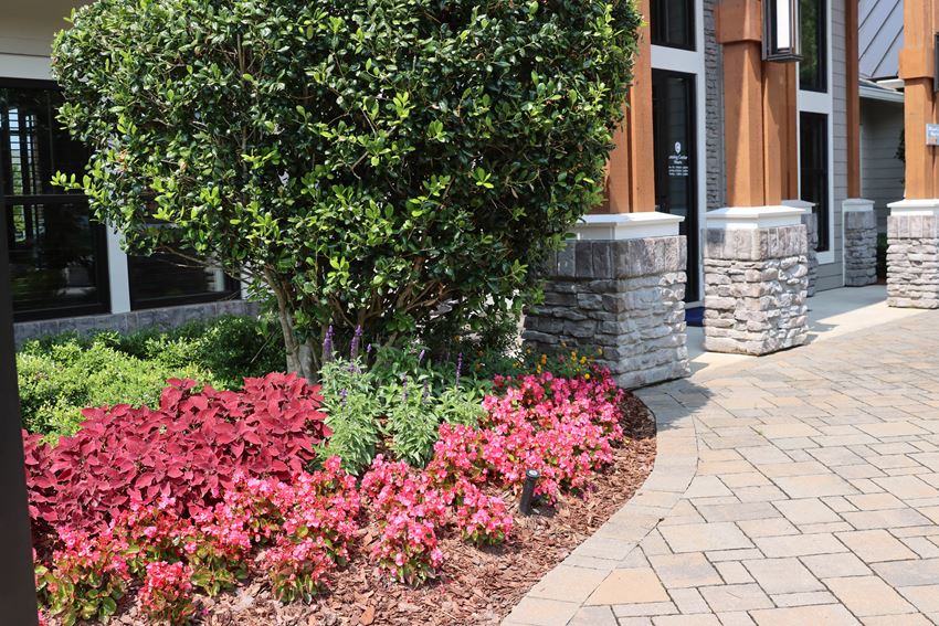 a brick walkway leads to the front door of a building - Photo Gallery