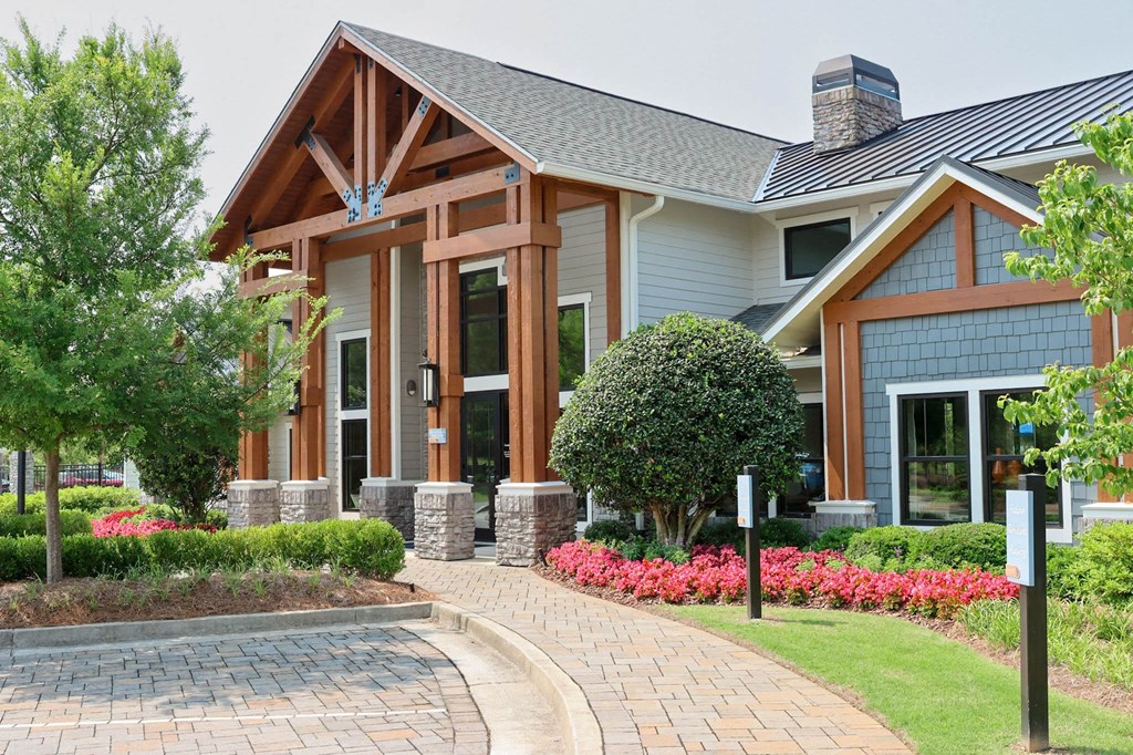 a home with a brick pathway leading to the front door