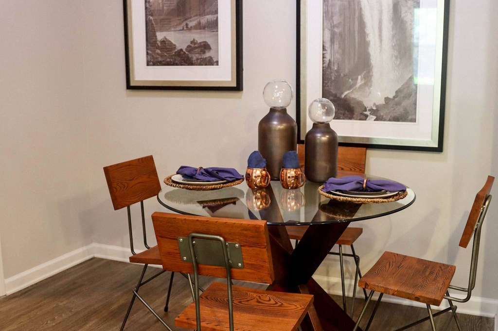 a dining room with a table and chairs
