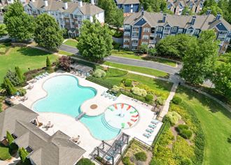 The Crest at Sugarloaf Apartment Community Located in Lawrenceville, GA Aerial View of  Large Swimming Pool with Tanning Ledge