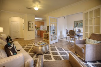 Living Room With Dining View Living Room With Dining View at The Crest at Sugarloaf, Lawrenceville, GA, 30044 - Photo Gallery 4