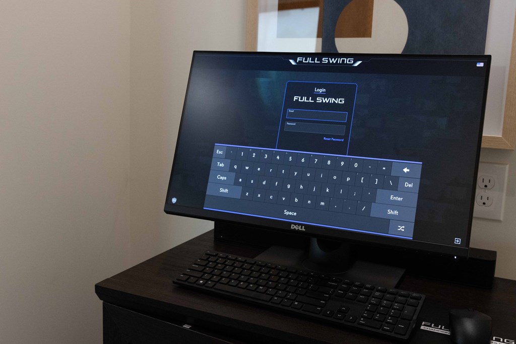 A Dell computer monitor with a Full Swing display setting. at The Crest at South Point Apartments, Georgia