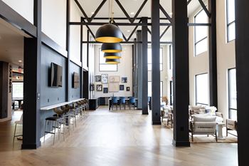 A large room with a long table and chairs at The Crest at South Point Apartments, Davenport , GA, 30253