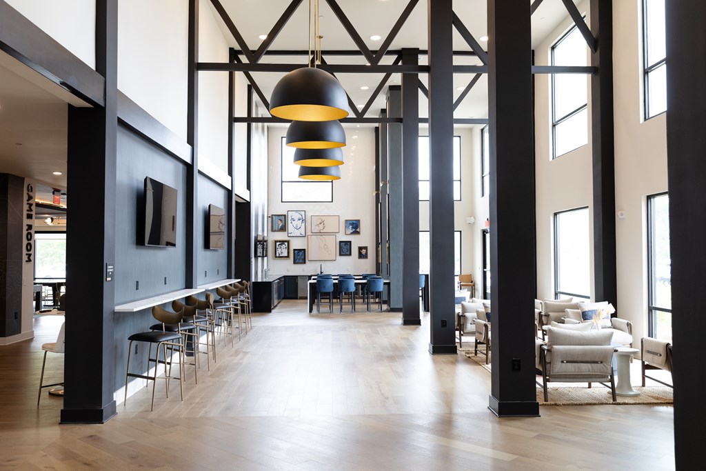 A large room with a long table and chairs at The Crest at South Point Apartments, Davenport , GA