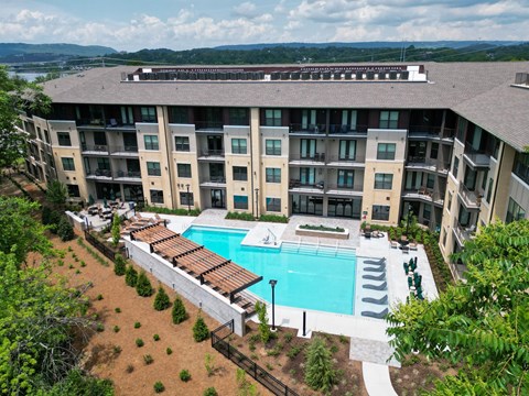 A large apartment complex with a pool.