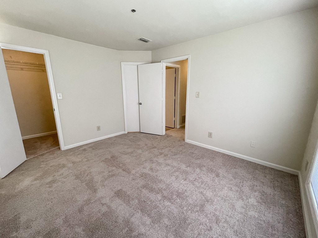 Drayton main bedroom with walk-in closet located in Duluth, GA 30096