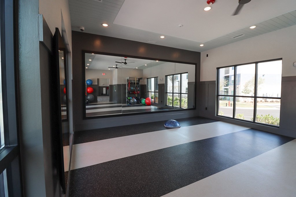 a workout room with a large window and a ball on the floor at The Crest at Acworth, Acworth, GA, 30102