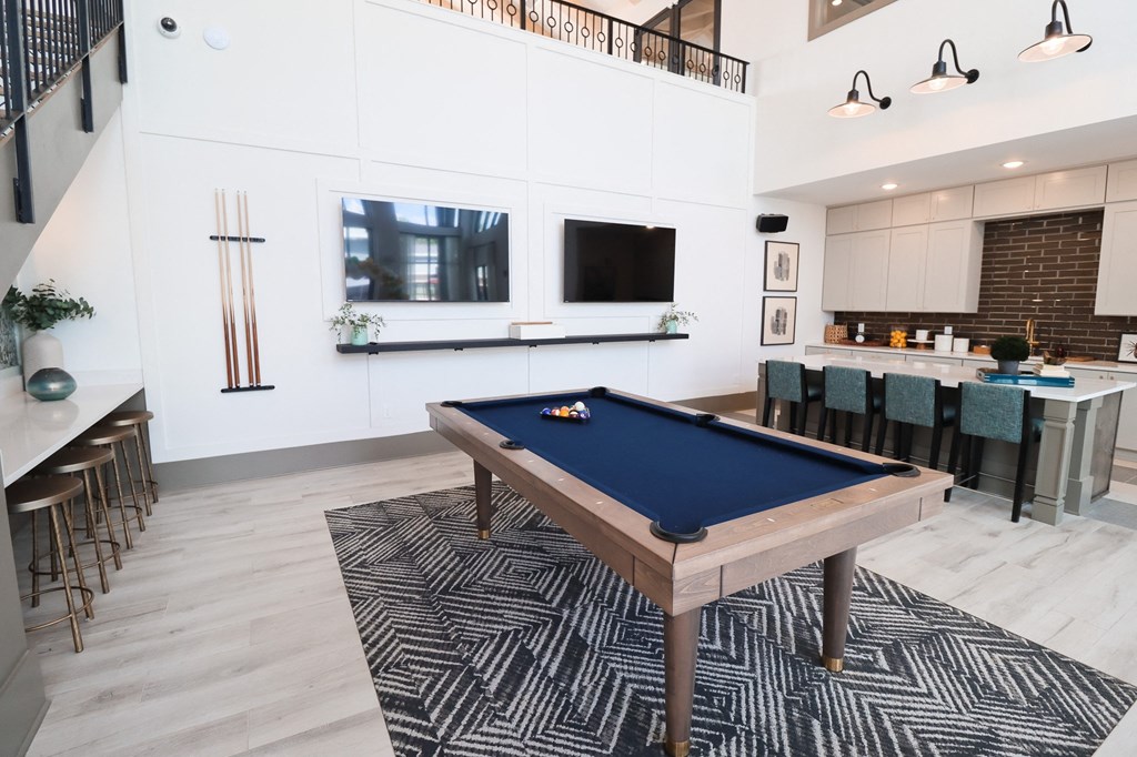 a pool table in a living room with a bar and a television at The Crest at Acworth, Georgia