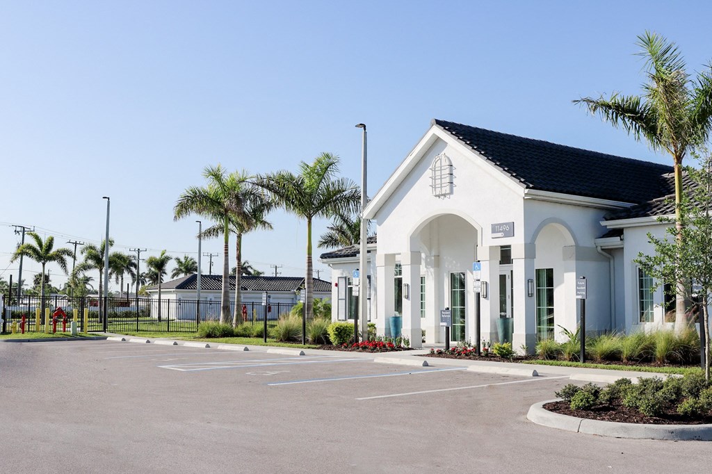 a building with a parking lot in front of it at The Crest at Naples, Florida