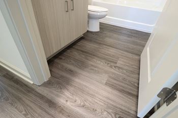 an image showing a bathroom with a wooden floor at The Crest at Acworth, Acworth, GA