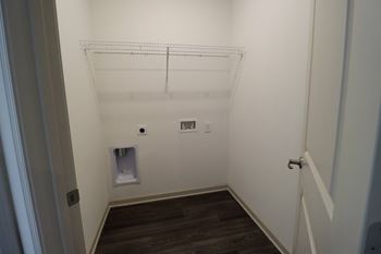 a small bathroom with a small toilet and a small sink at The Crest at Acworth, Acworth, GA