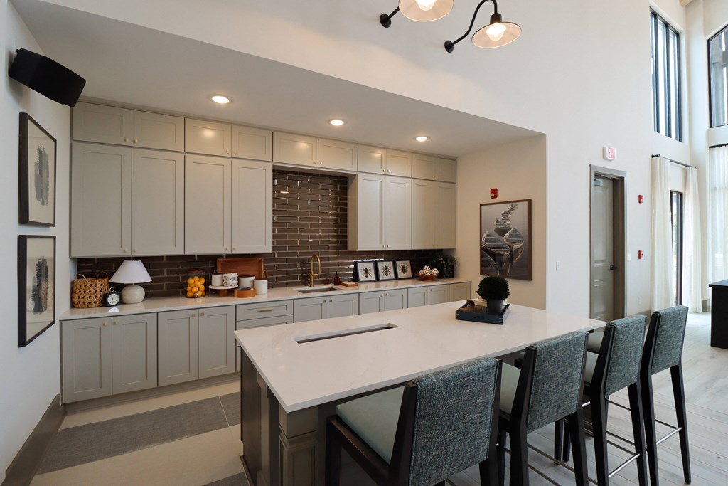 a large white kitchen with a large island at The Crest at Acworth, Acworth, GA
