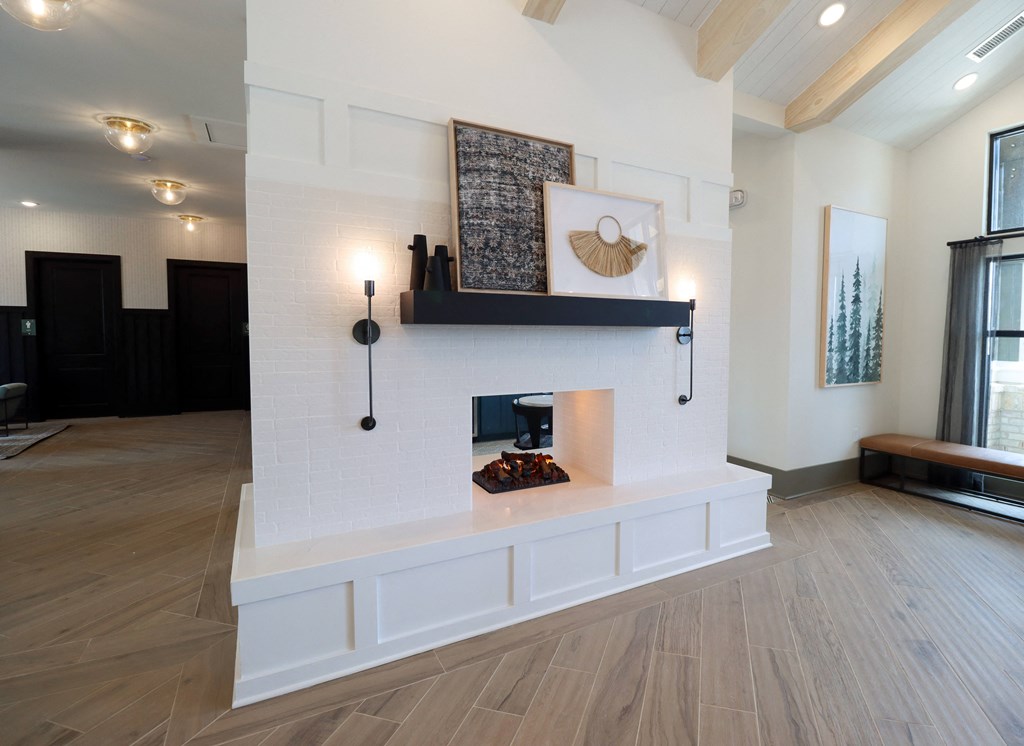 a living room with a fireplace and hardwood floors at The Crest at Acworth, Acworth, GA, 30102