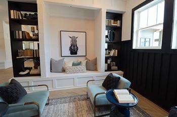 a living room with a couch and two chairs at The Crest at Acworth, Georgia