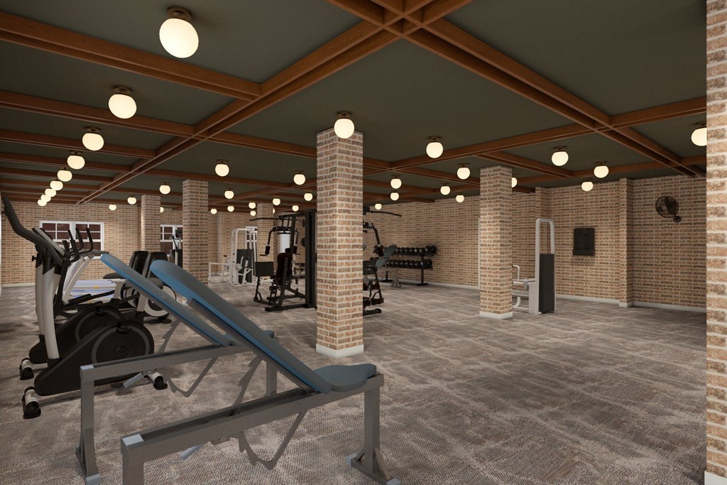 A gym with a variety of equipment including treadmills, weights, and exercise machines.